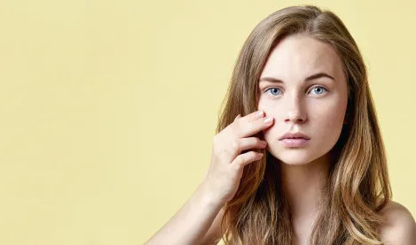 Woman checking her skin